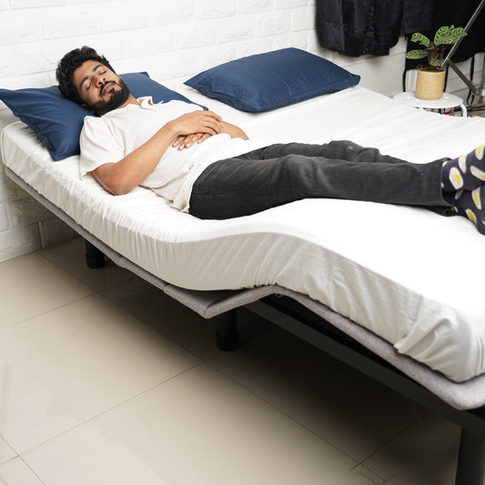 A man relaxing on Jade adjustable bed A300